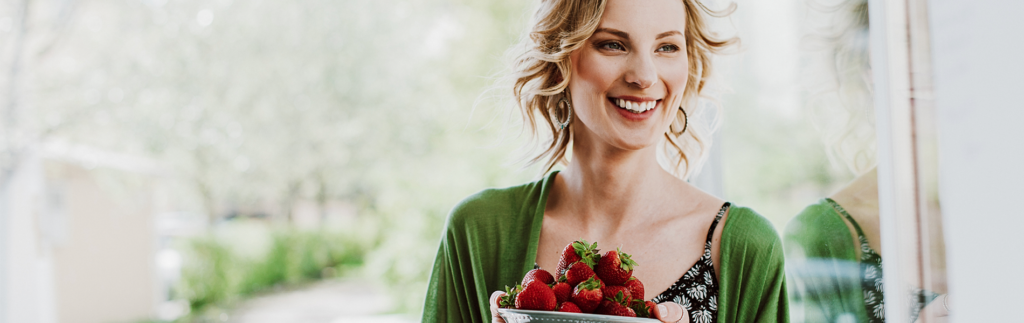 Woman with a bunch of strawberries