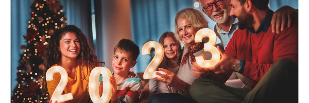 Family holding up 2023 during the holidays
